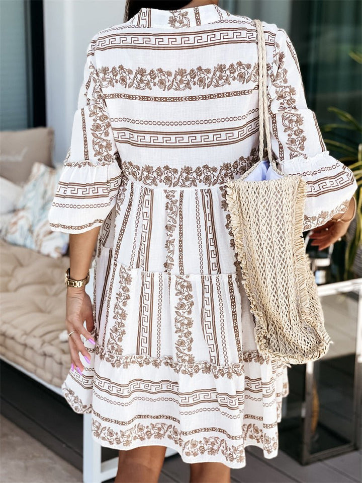 Comfortable flowy printed mini dress with tiered flare sleeves, great women's wear for vacation.