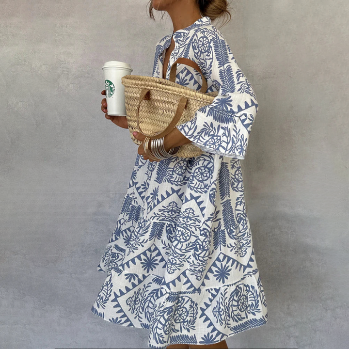 Women's boho print swing dress featuring a stylish V-neck and comfortable 3/4 sleeves, perfect for summer.