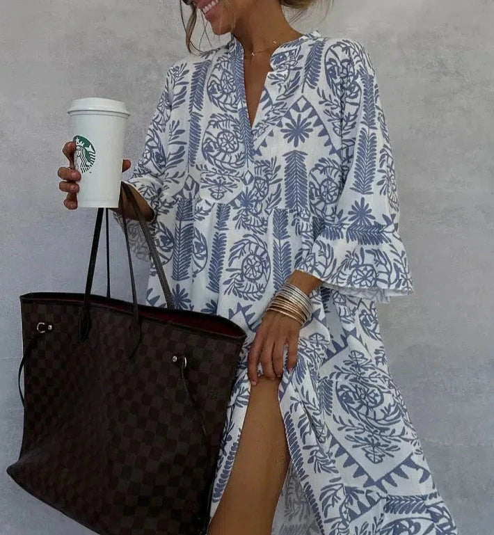 Casual floral midi dress for women, ideal resort wear with a flattering V-neck and elegant 3/4 sleeves.
