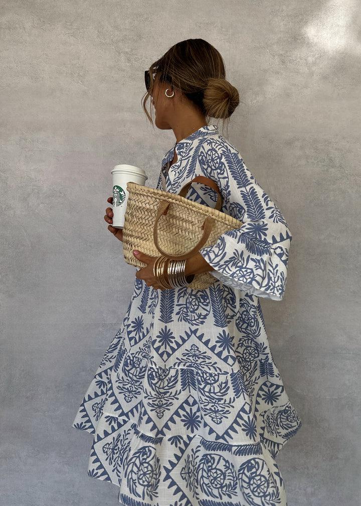 Vibrant bohemian print swing dress with a V-neck and 3/4 sleeves, a chic choice for vacation or daily wear.