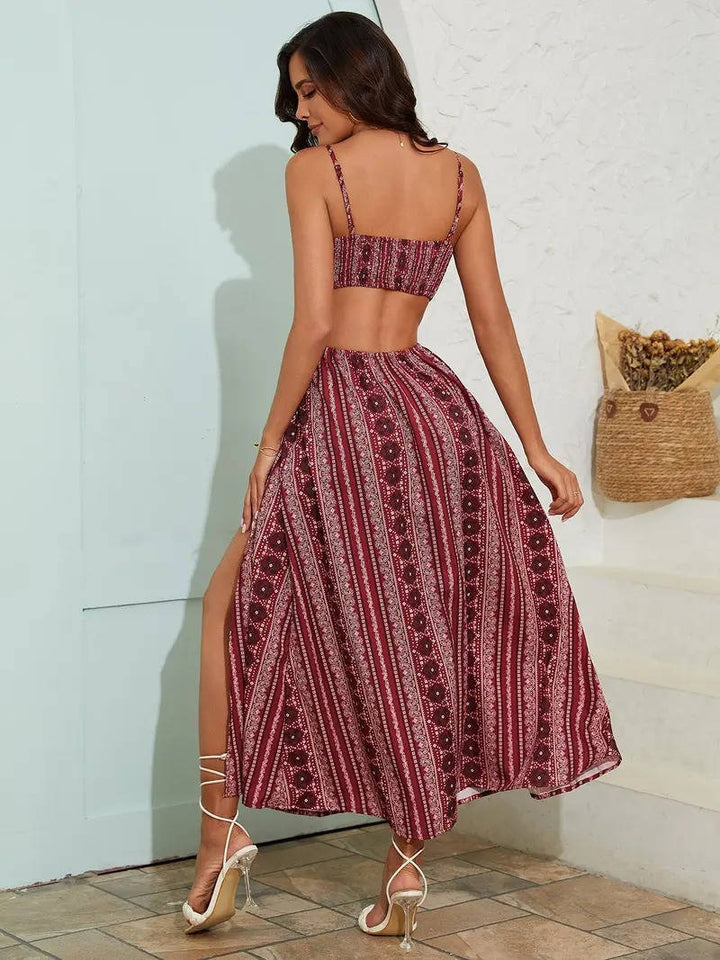 Fashionable women's bohemian maxi sundress with vibrant print, adjustable straps, and side slit.