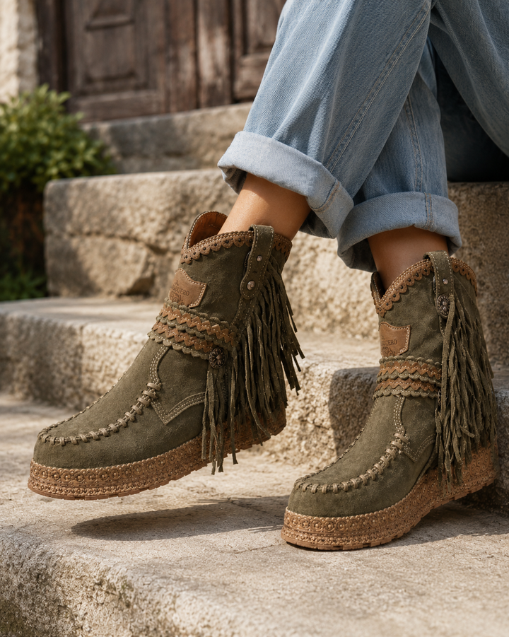 Women's boho western ankle boots with stylish fringe, perfect for casual chic or festival wear. Round toe, flat heel.
