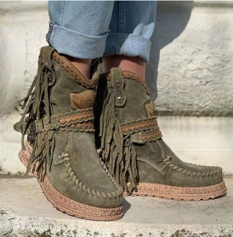 Stylish women's boho ankle boots featuring western fringe detailing. Versatile fashion footwear for any casual outfit.