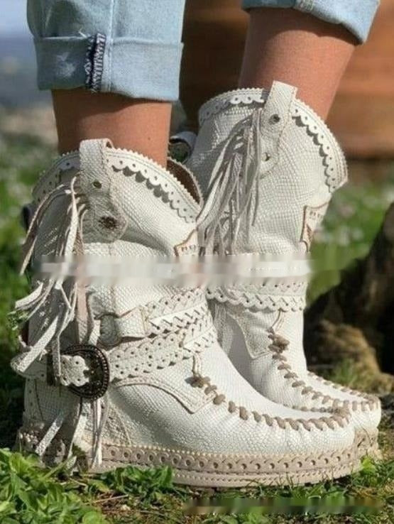 Fashionable women's fringe ankle boots in a boho western style. Casual chic footwear, great for festivals & travel.