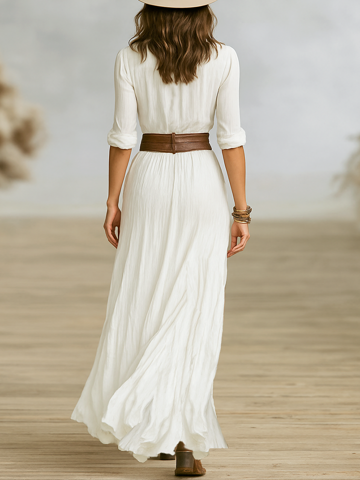 Women's flowy maxi dress in boho western style, featuring a trendy high slit and long silhouette for fashion.
