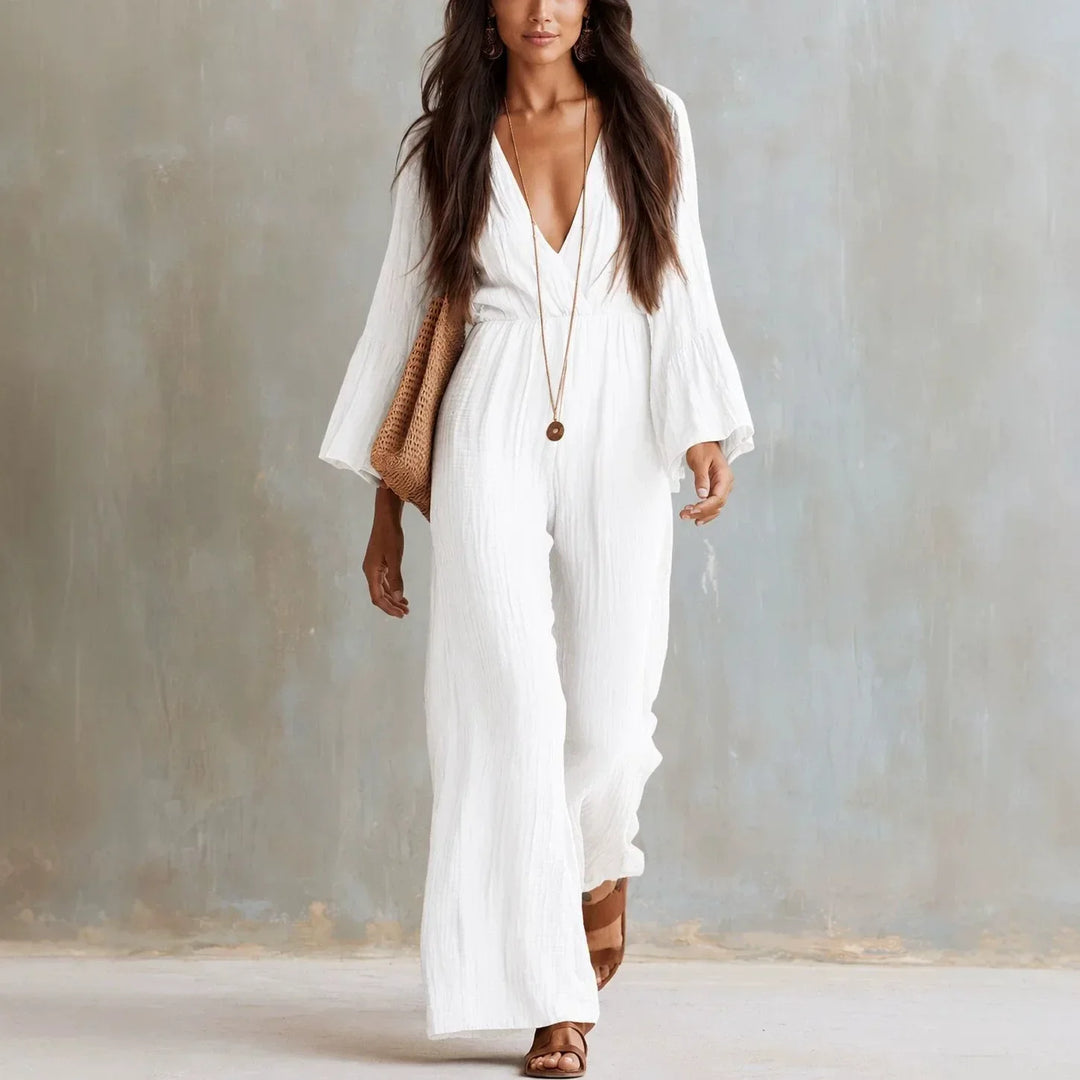 Women's boho wide leg jumpsuit with deep V-neck and elegant flare sleeves. Perfect for summer vacation & casual chic.