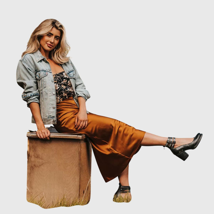 Stylish women's ankle boots with bold buckle straps and trendy cutouts. Fashion-forward block heel footwear.