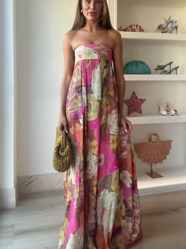 Vibrant floral strapless empire waist maxi dress for women, a flowy and comfortable summer party dress.