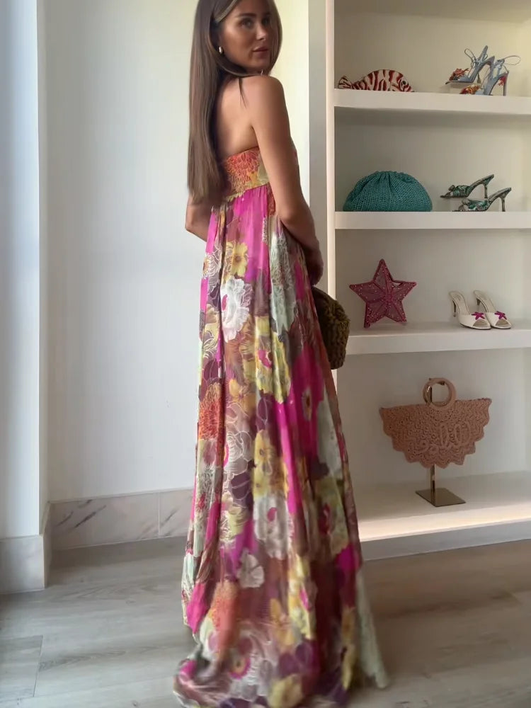 Chic women's bold floral strapless maxi dress with an elegant empire waist, perfect for any special occasion.