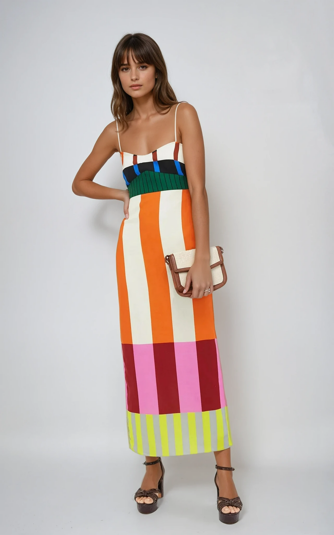 Fashion-forward women's bodycon midi dress with bold colourblock stripes & spaghetti straps, ideal for summer.