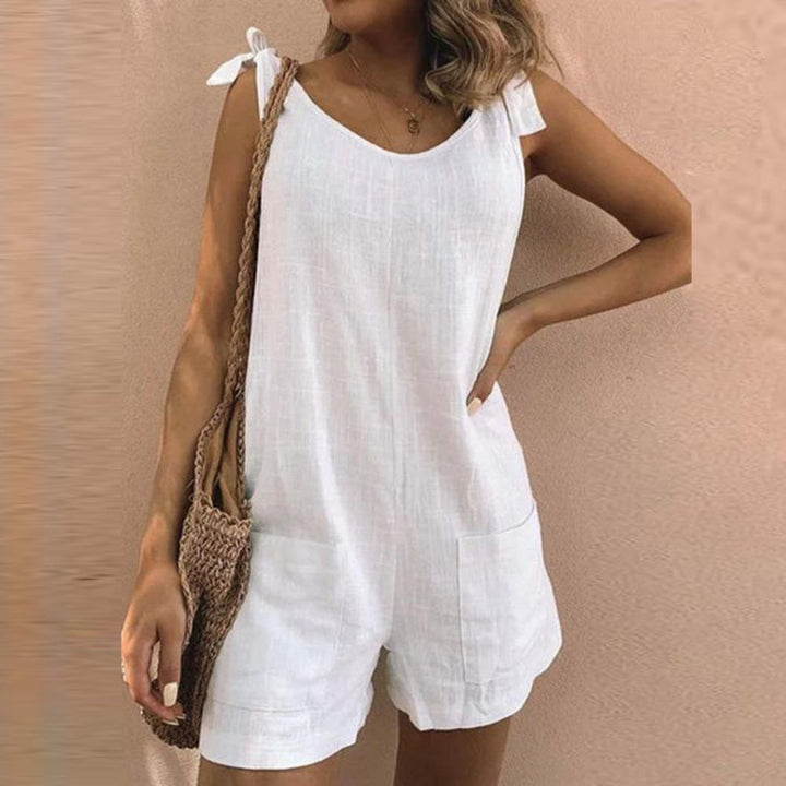 Women's bow strap playsuit with pocket design & adjustable straps. Relaxed fit, perfect for summer casual wear.