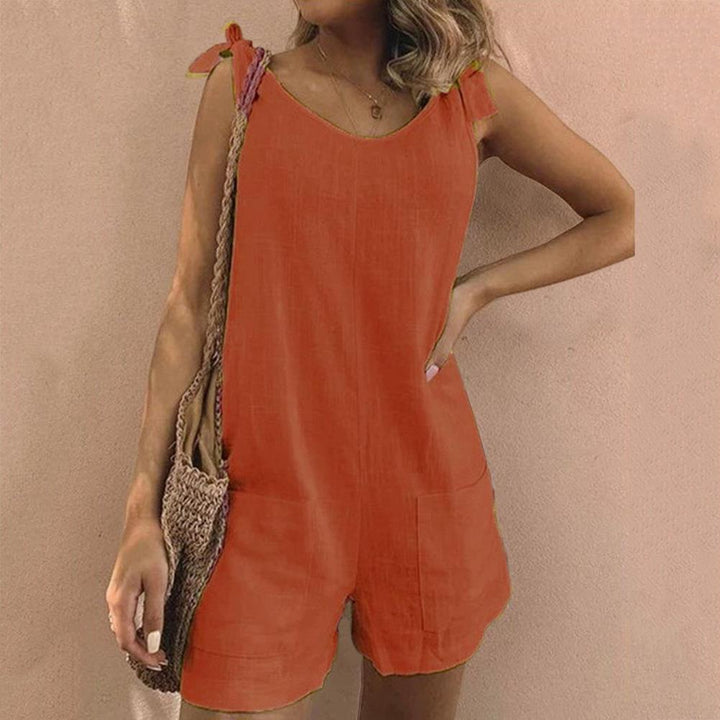 Lightweight women's playsuit with cute bow straps and pockets. Ideal one-piece for warm weather & vacation.