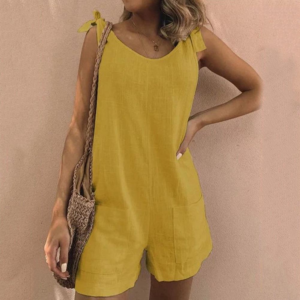 Casual women's playsuit featuring bow straps, practical pockets, and adjustable fit for comfortable summer outfits.