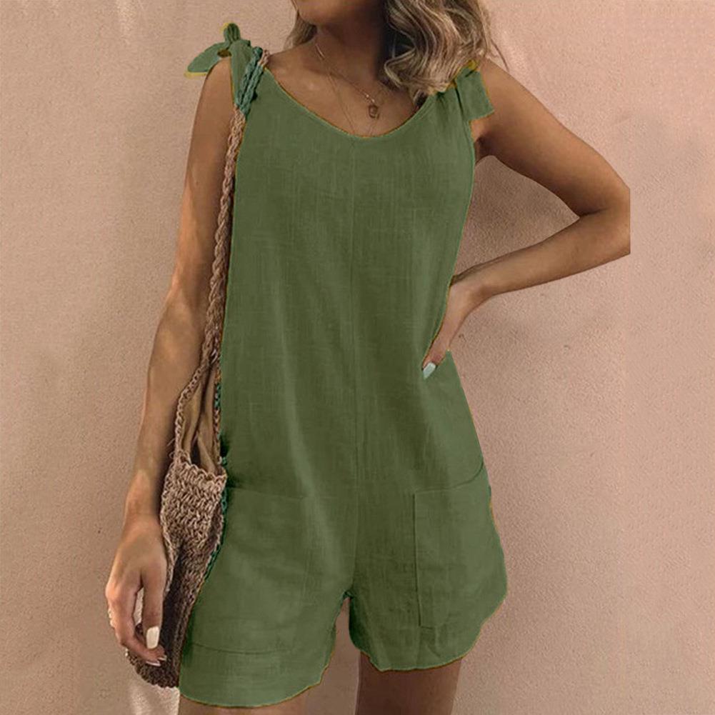 Women's summer playsuit with adjustable bow straps & functional pockets. Lightweight & airy for warm weather.