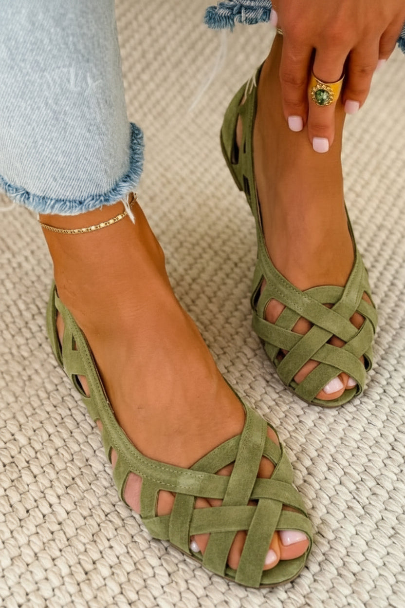 Women's elegant braided crossover strap flat sandals. Open-toe, slip-on, comfortable summer footwear.