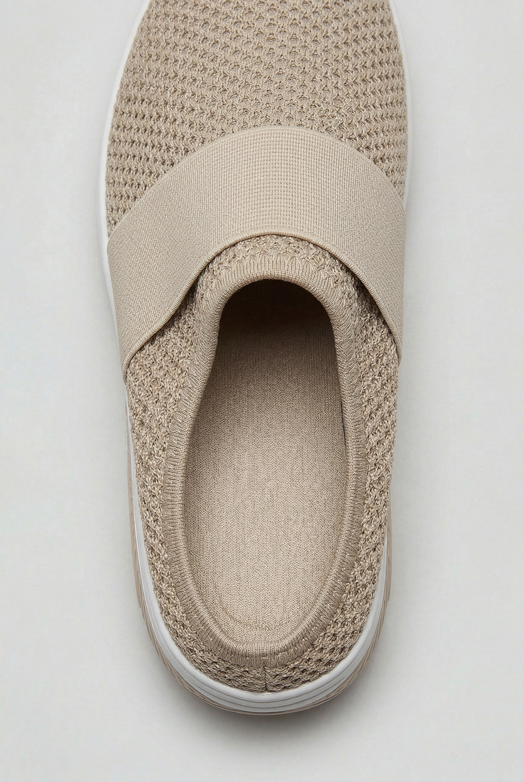 Comfortable women's mules featuring a supportive air cushion sole for ultimate breathability and all-day wear.