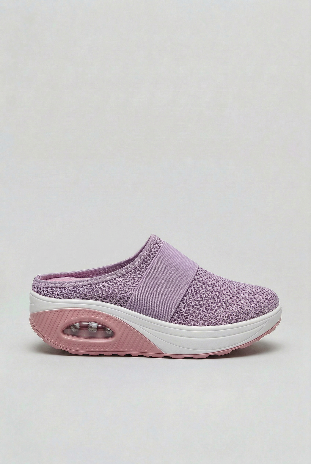 Women's comfort mules, breathable slip-on footwear with an air cushion sole for lightweight, casual everyday wear.