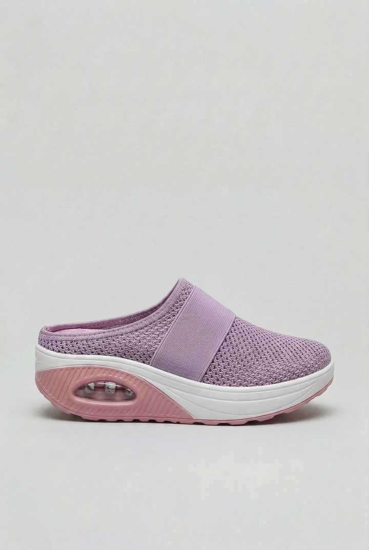 Women's comfort mules, breathable slip-on footwear with an air cushion sole for lightweight, casual everyday wear.