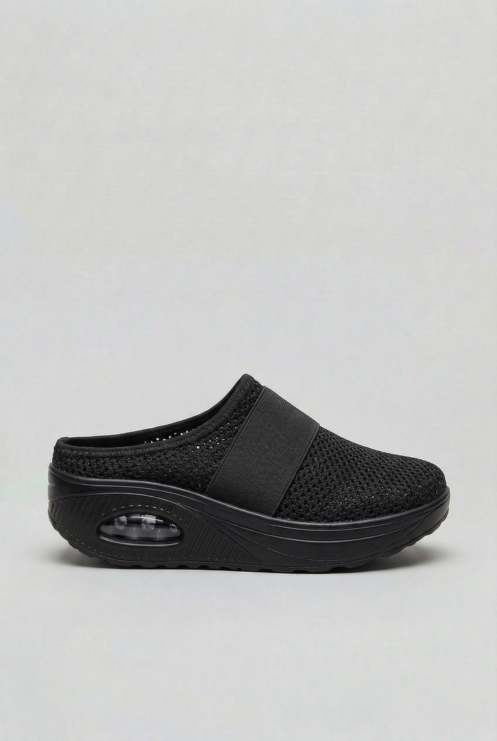 Pair of women's breathable comfort mules, showcasing the air cushion sole & open back for lightweight support.
