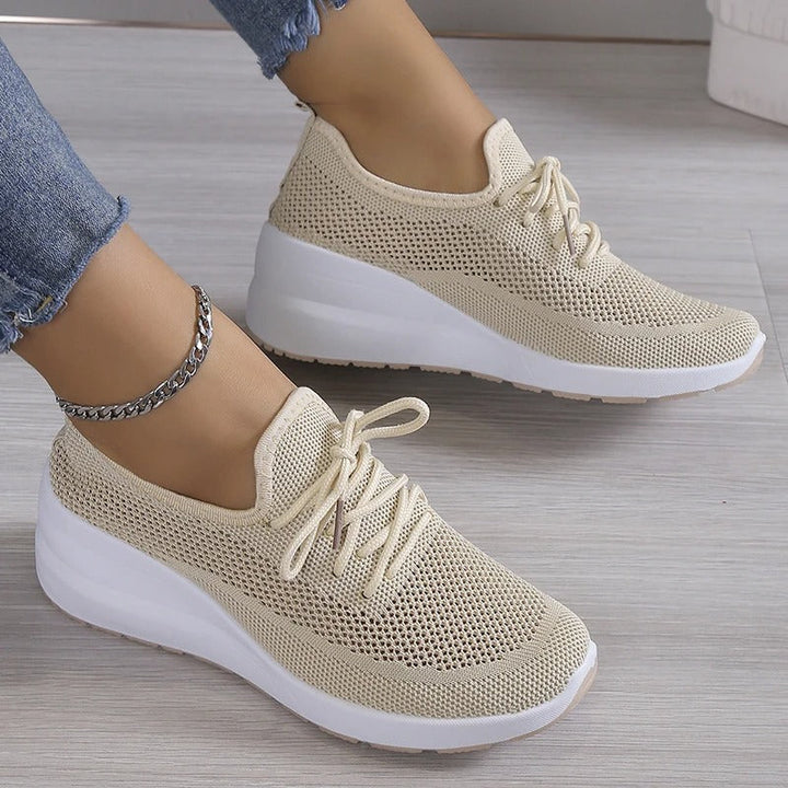 Women's breathable platform wedge sneakers for elevated comfort & everyday walking. Modern fashion footwear.