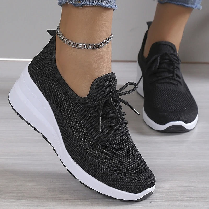 Chic women's platform wedge sneakers. Breathable fabric ensures elevated comfort for all-day wear.