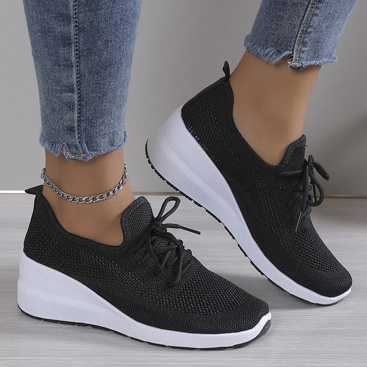 Modern women's breathable athletic wedge sneakers. Combines platform height with ultimate comfort.
