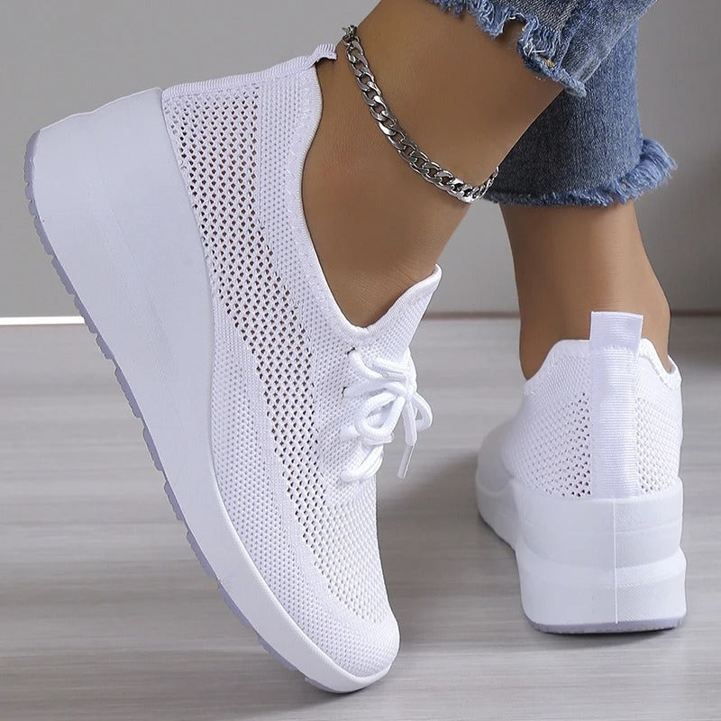 Versatile women's breathable wedge platform sneakers. Offers elevated style, comfort & support for walking.