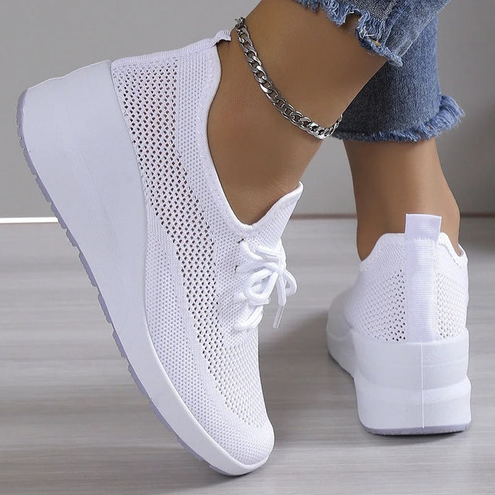 Versatile women's breathable wedge platform sneakers. Offers elevated style, comfort & support for walking.