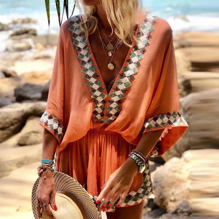Flowy women's boho V-neck romper, ideal casual one-piece for sunny days, resort wear & effortless style.