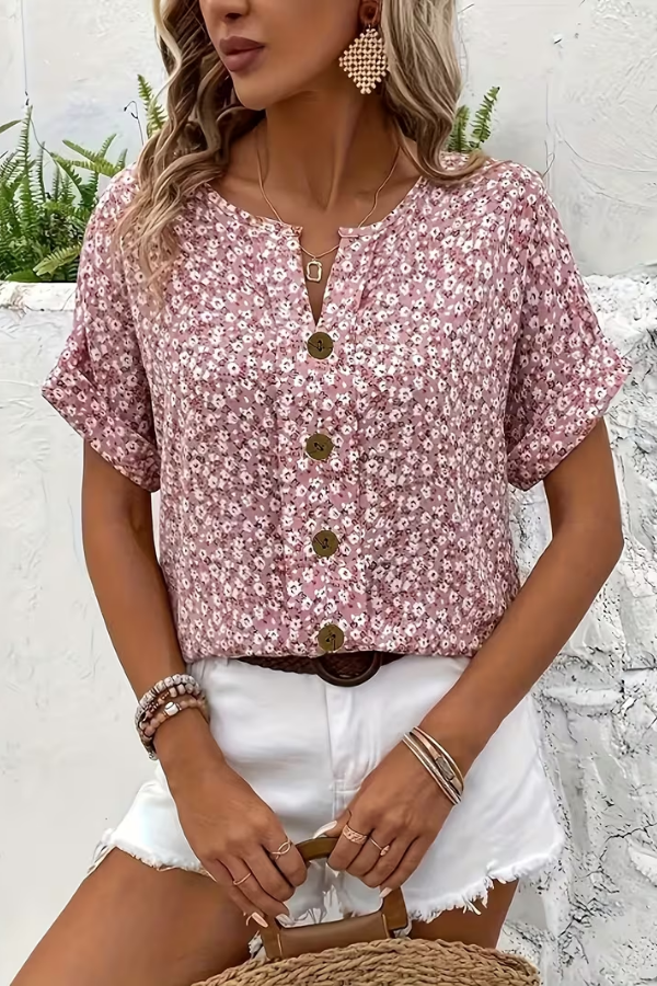 Women's short-sleeve floral blouse, vibrant pattern, relaxed fit for ultimate summer comfort.