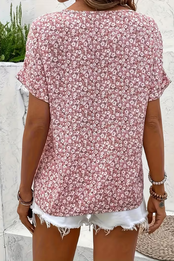 Comfortable women's floral summer blouse, breezy short-sleeve top for a relaxed and stylish look.