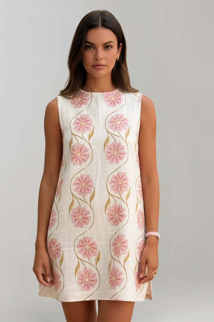 Casual women's summer floral mini dress in pink, featuring a sleeveless A-line design and comfortable round neck.