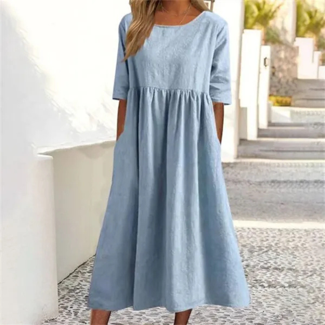 Women's breezy smocked-waist midi dress with short sleeves, perfect for summer comfort and style.