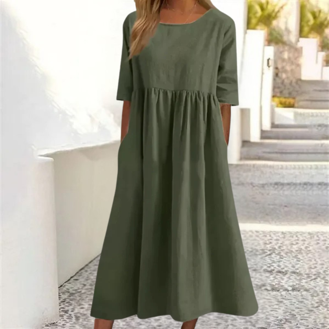 Comfortable women's breezy midi dress with smocked waist, short sleeves, ideal for warm weather.