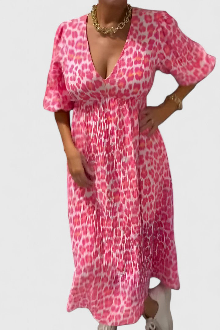 Elegant women's tropical stripe flowy maxi dress featuring a V-neck and puff sleeves for chic summer vacations.