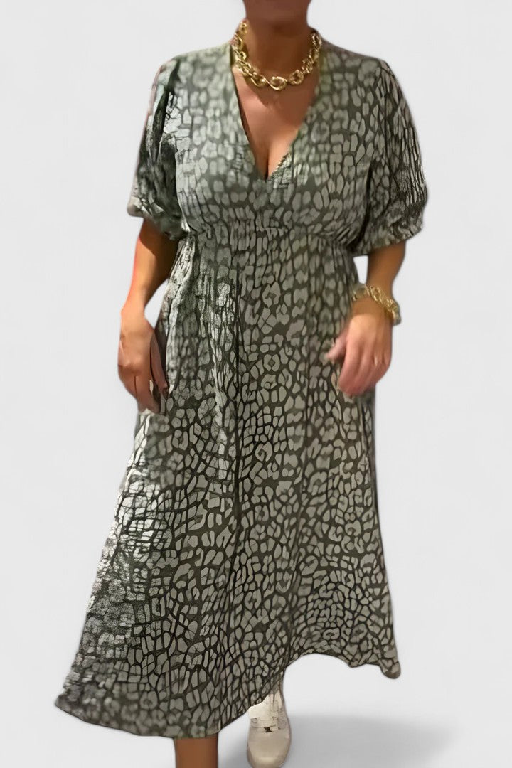 Comfortable women's empire waist tropical stripe maxi dress with V-neck & puff sleeves, perfect for breezy summer days.