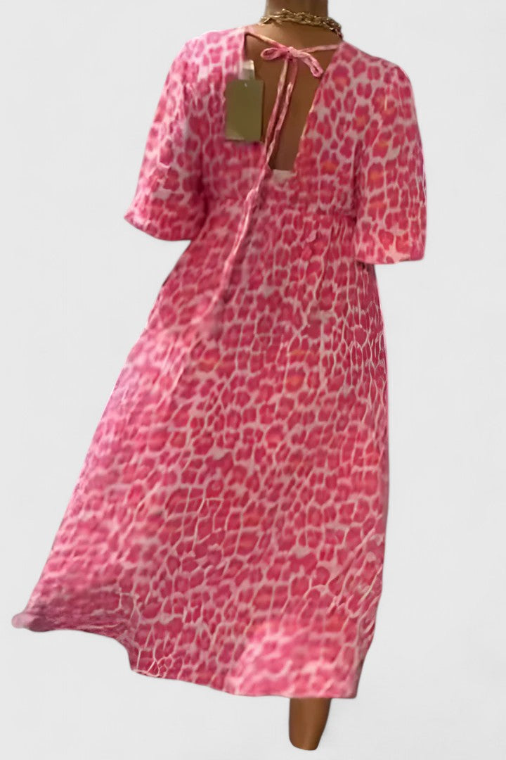 Flattering women's breezy V-neck maxi dress with tropical stripes & puff sleeves, perfect vacation fashion.