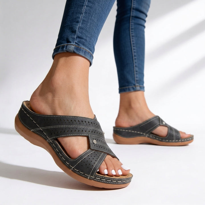 Stylish women's gray peep toe wedge sandals. Casual crossover slip-on footwear, great for vacation & summer fashion.