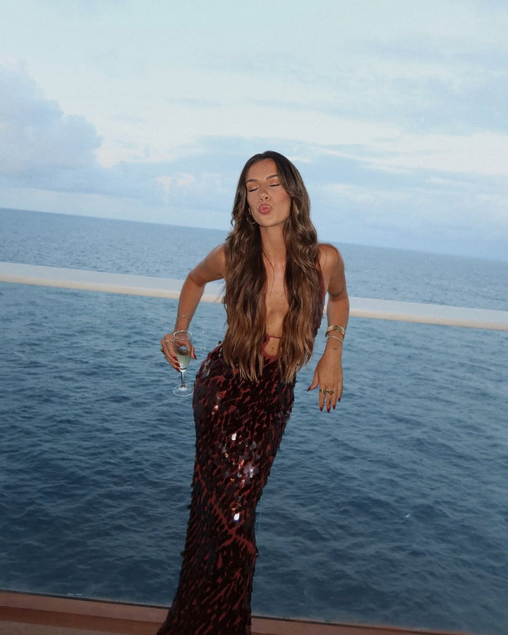 Fitted sparkling burgundy sequin evening wear, a chic plunge neckline maxi dress for prom or special events.