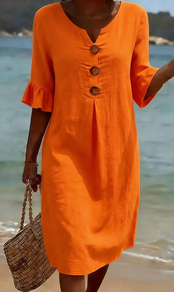 Lightweight women's midi dress, button-front, ruffle sleeves, ideal for warm weather and beach days.