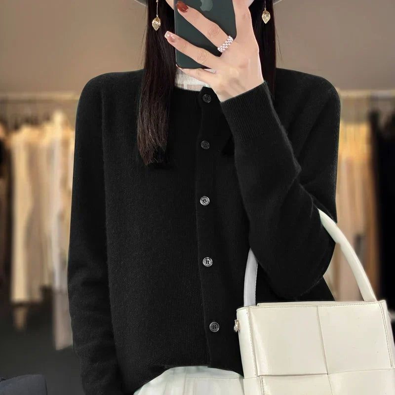 Classic women's round neck knit cardigan, button front. Long sleeve, versatile wardrobe essential.