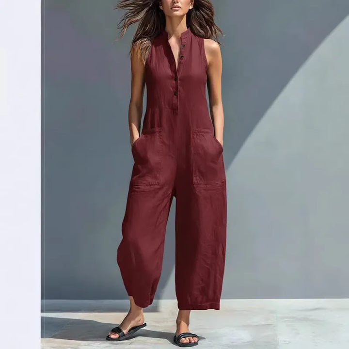 Modern women's sleeveless button-up jumpsuit with a stand collar; a versatile casual one-piece.