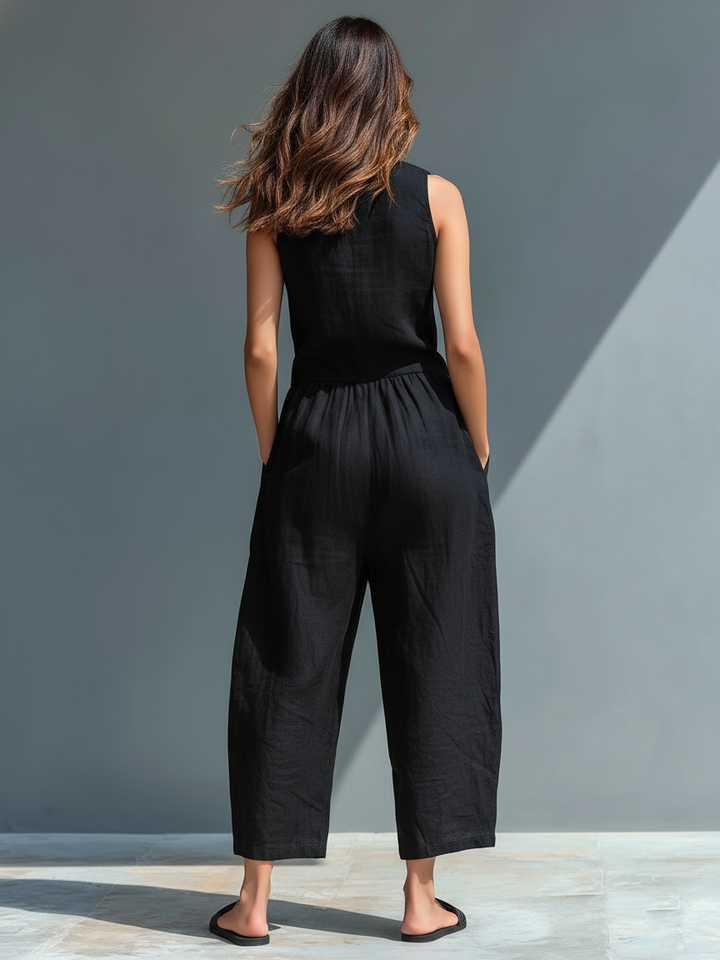Stylish women's loose-fit one-piece jumpsuit featuring a button-up front & stand collar.