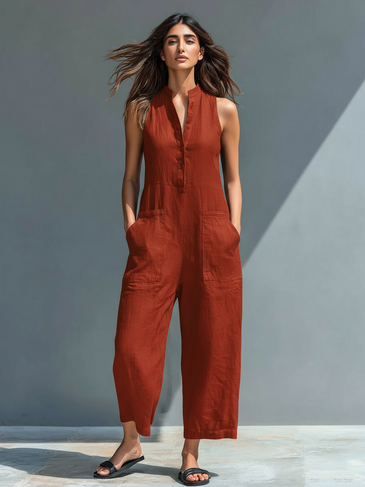 Fashionable women's sleeveless jumpsuit with a stand collar, full button-up closure.