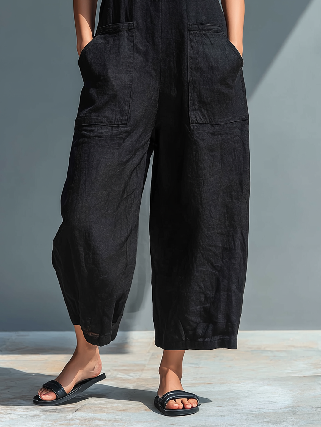 Chic women's one-piece sleeveless jumpsuit, stand collar, button-up, perfect for travel.