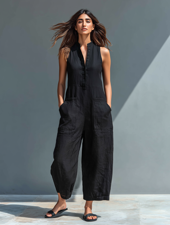 Comfy women's loose fit jumpsuit with a stand collar, sleeveless and button-up front.