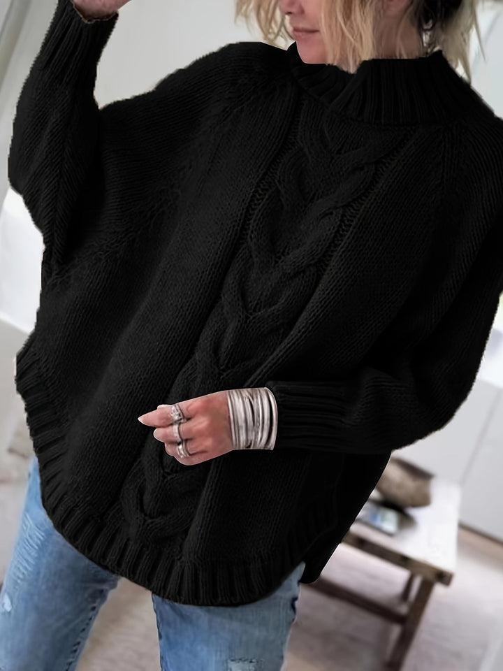 Chunky cable knit women's sweater, high neck & flared hem. Ideal for warm winter style & casual comfort.