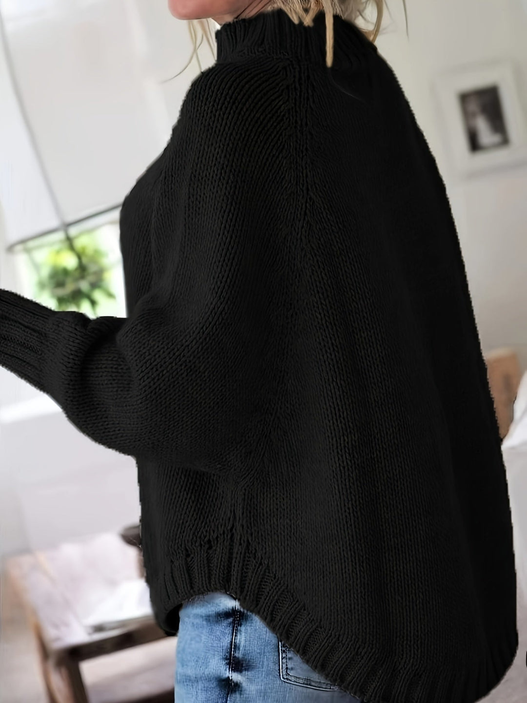 Comfortable women's high-neck cable knit sweater with a trendy flared hem. Great for everyday style.