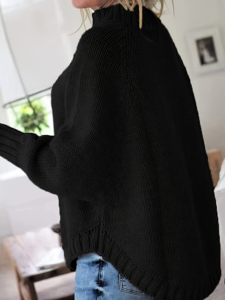 Comfortable women's high-neck cable knit sweater with a trendy flared hem. Great for everyday style.
