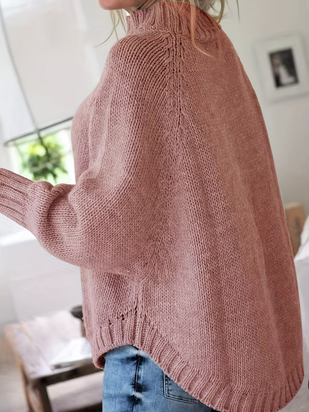 Relaxed fit women's cable knit sweater, high neck, flared hem. Embrace cozy casual wear this fall.